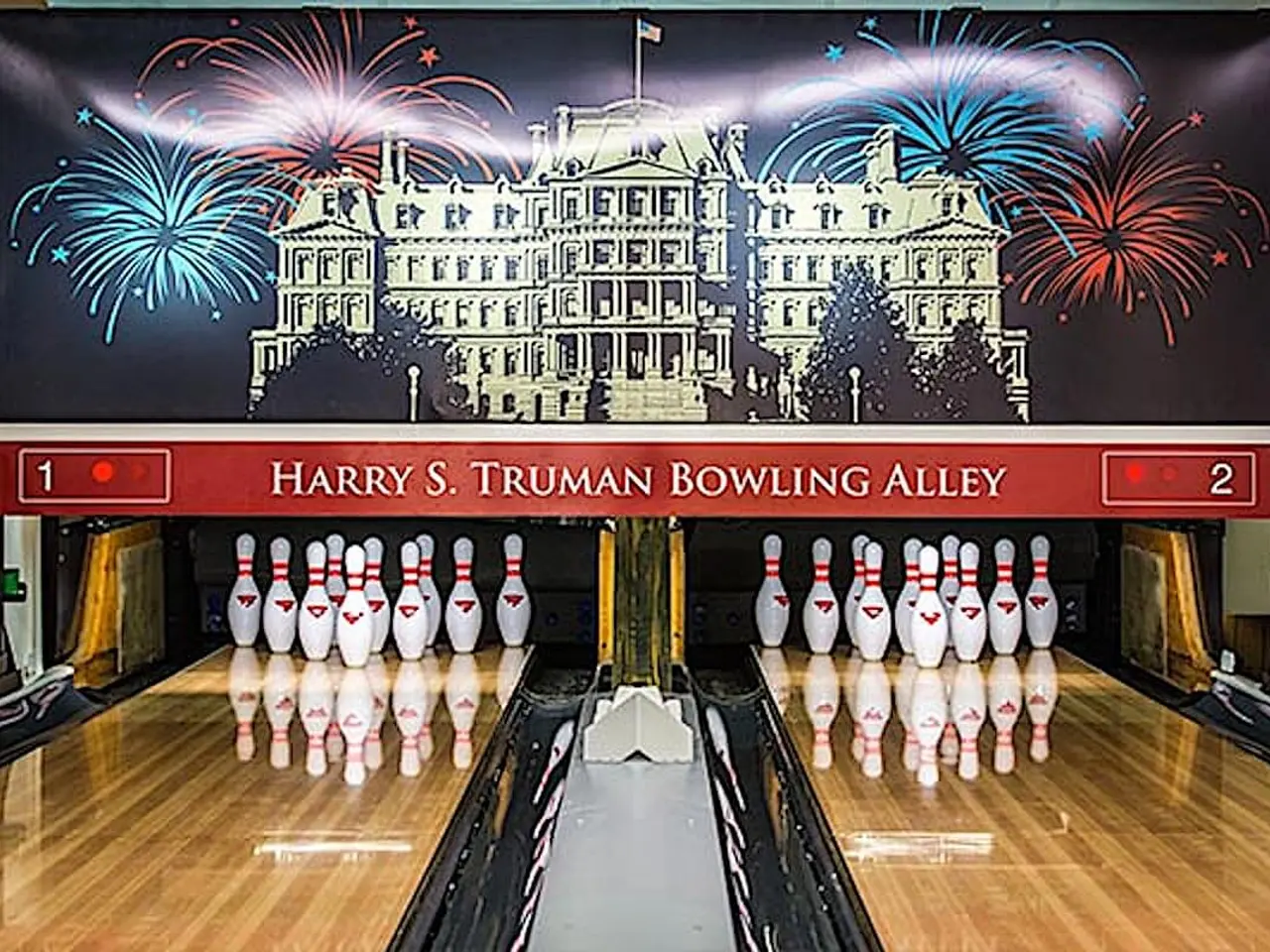 The image shows Harry S. Truman Bowling Alley, with bowling pins set up in the center of the room....