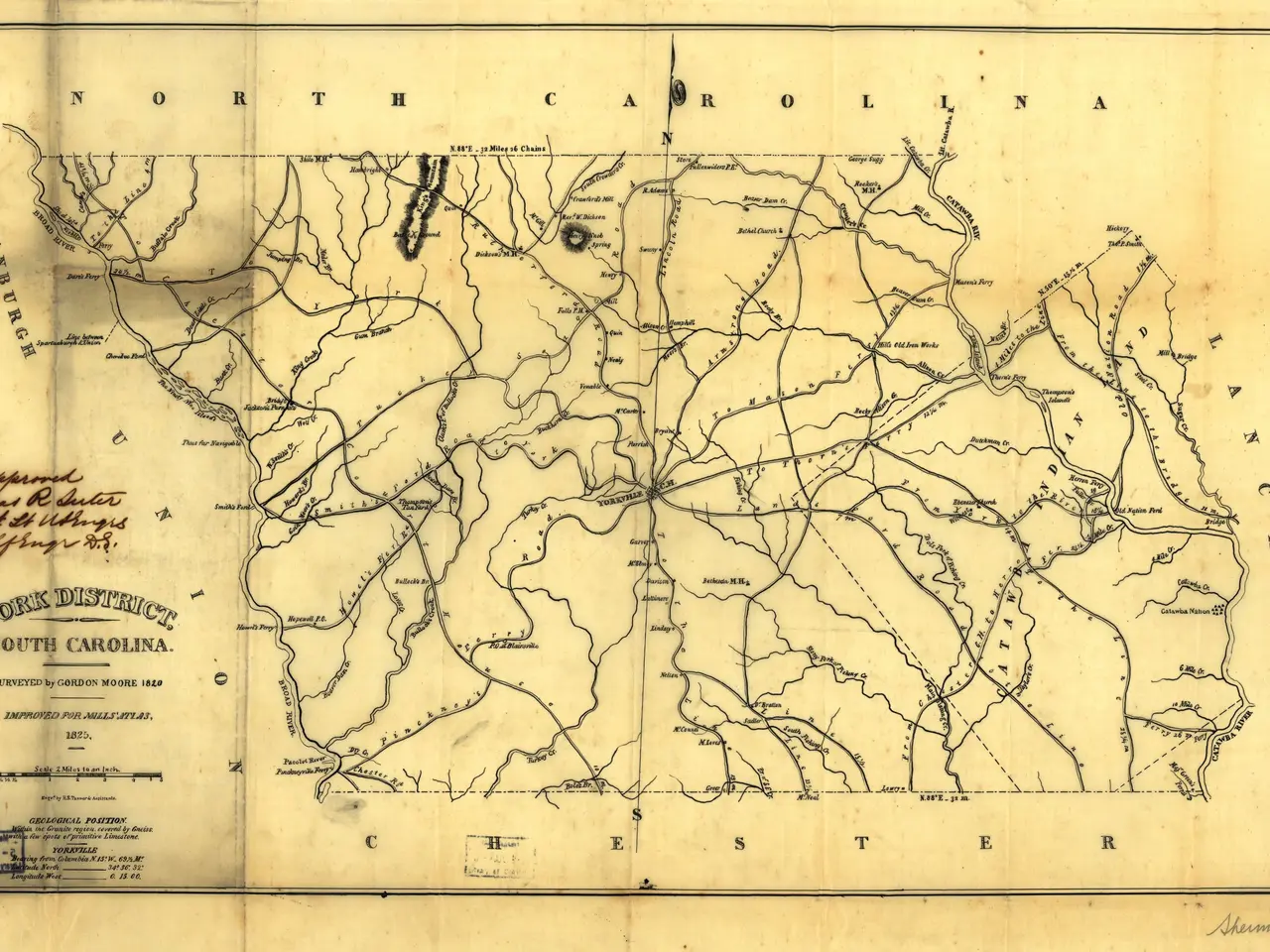 The image shows an old map of the state of North Carolina on a piece of paper. The map is detailed...