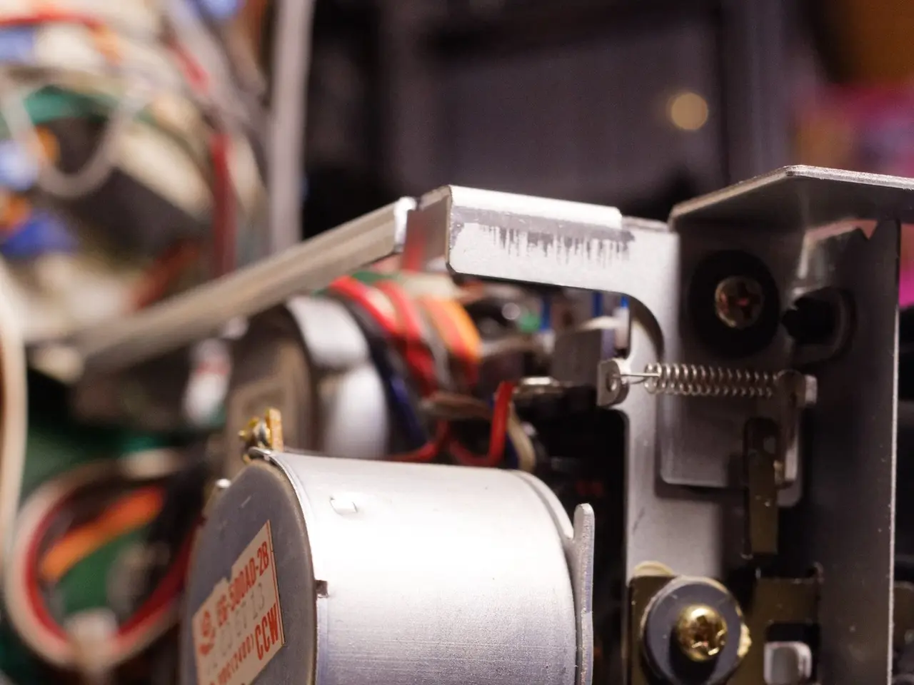 The image shows a close up of a machine with wires attached to it, which appears to be a...