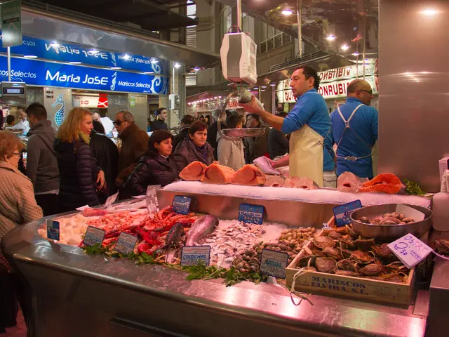 This picture might be taken in a market, in this picture at the bottom there are some fishes and...
