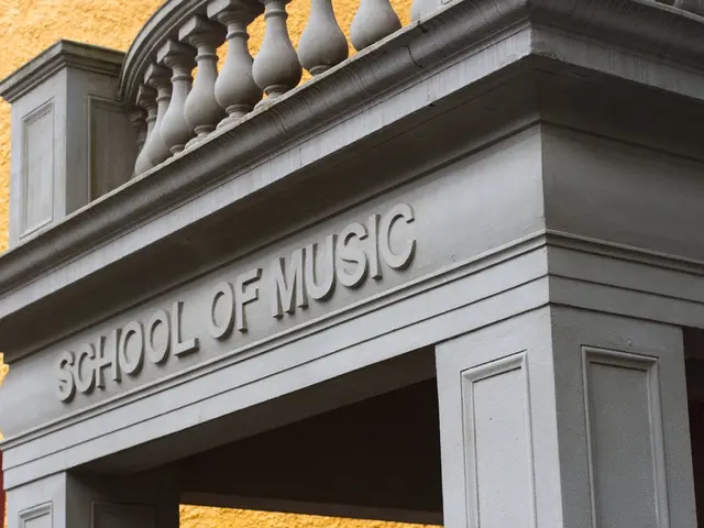 In this picture I can see a building with the text on it.