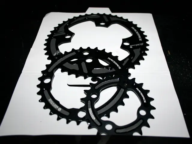 In this image, we can see hubcaps and a paper are on the table.