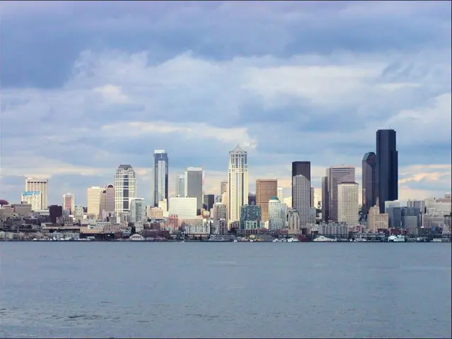 At the bottom of the image there is water. Behind the water there are buildings. At the top of the...