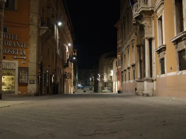 This image is clicked outside. There are buildings on the left side and right side. There are...