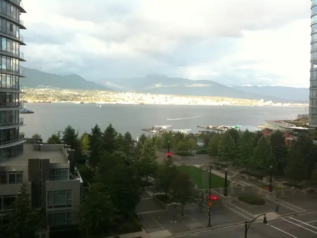 In this image on the right side and left side there are some buildings, trees, poles. At the bottom...