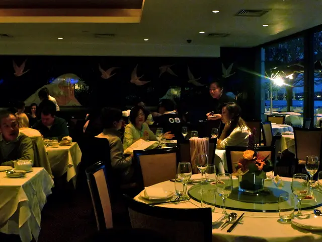 There are group of people sitting in a restaurant.