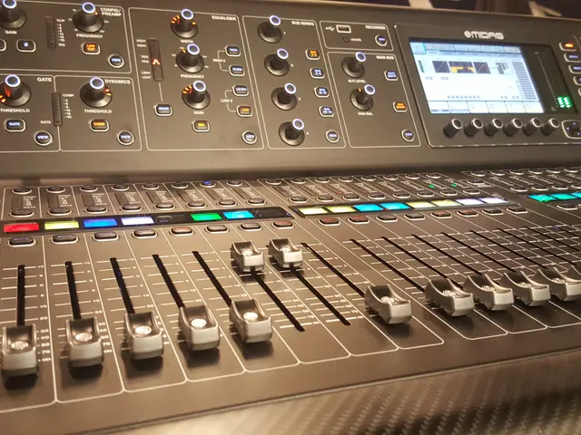 The image shows an Allen & Heath QU-2400 Digital Mixer, an electronic device with many buttons and...