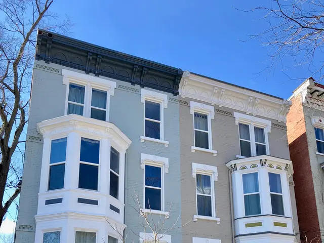 The image shows a row of townhouses in Washington, DC, with windows, doors, stairs, railings,...