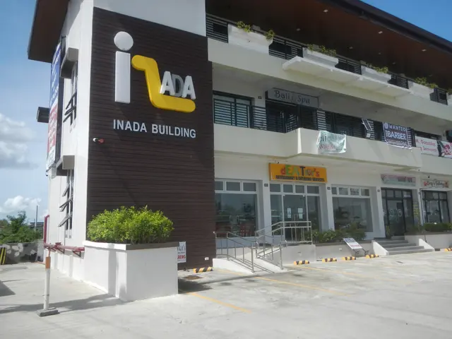The image shows a building with a sign that reads "Iada Building" in front of it, surrounded by...
