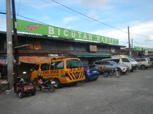The image shows a bustling bicutan market in Cebu City, Philippines, with vehicles on the road,...
