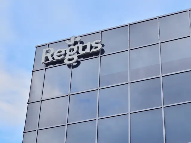 The image shows a building with a Regus sign on the side of it, surrounded by a sky with clouds in...