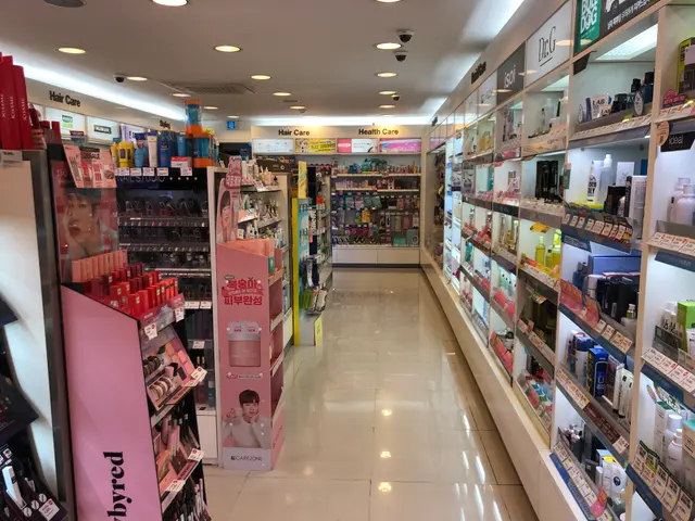 The image shows a store filled with lots of different types of cosmetics, arranged in racks and on...