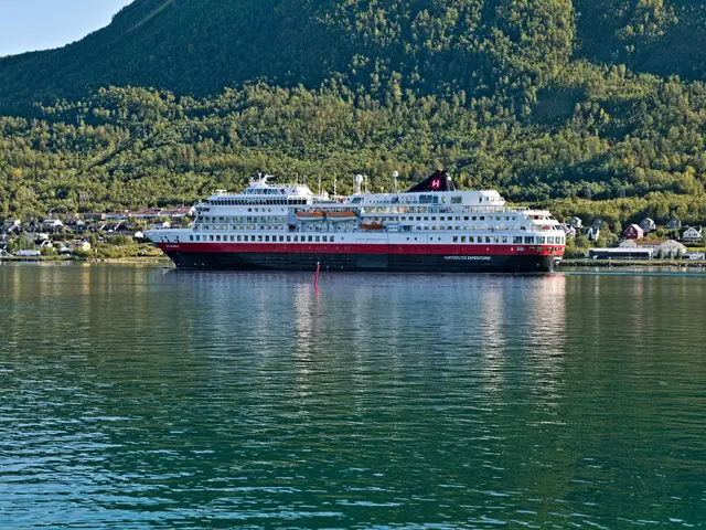 The image shows a large cruise ship, the Norwegian Cruise Line's Norwegian Explorer, floating on...