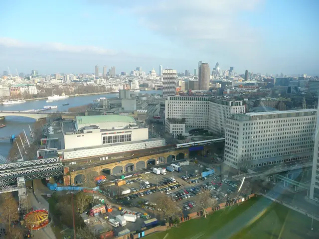 The image shows a view of the city of London from the top of a skyscraper. We can see many...