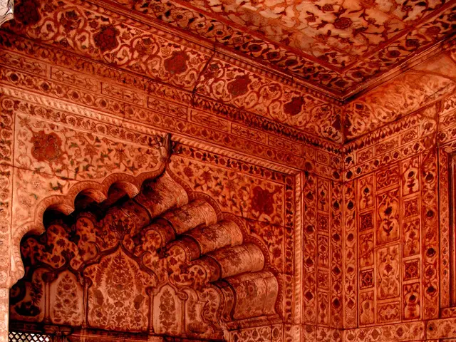 The image shows the interior of the Red Fort in Agra, Uttar Pradesh, India. The walls are adorned...