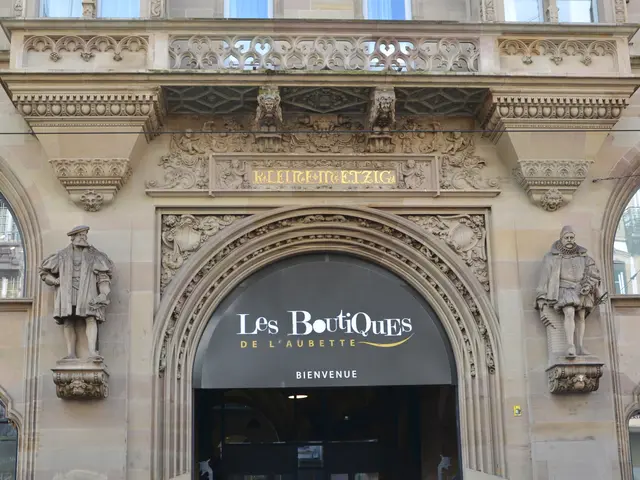 The image shows the entrance to Les Boutiques de l'Aubette in Paris, France. It is a building with...
