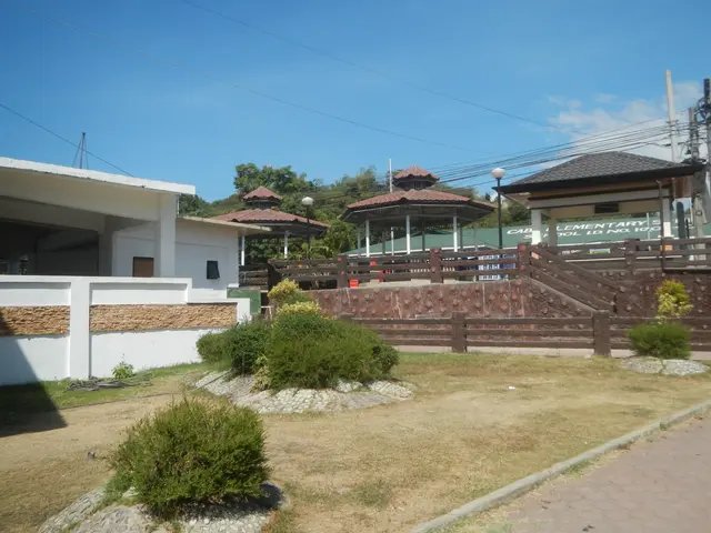 The image shows a house for sale in Cebu City, Philippines. It has a roof and windows, a wooden...