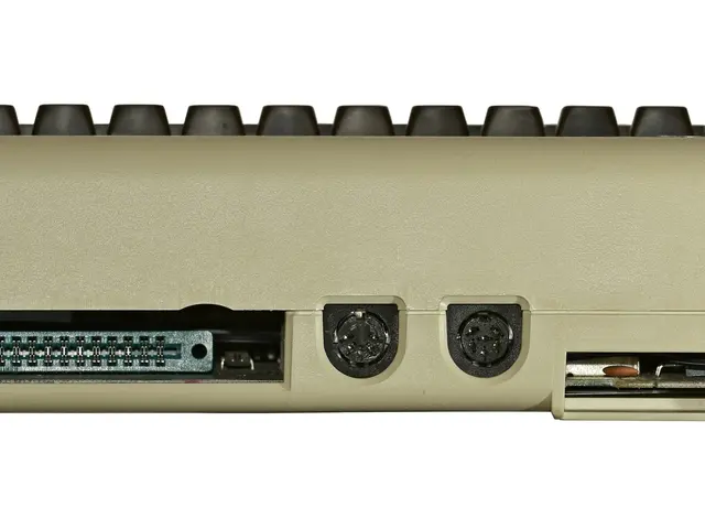 The image shows a close up of a cream-colored electronic device on a white background.