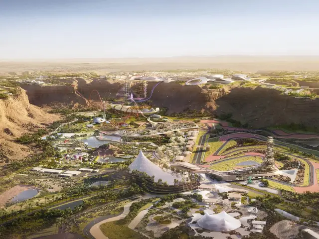 The image shows an aerial view of a city in the middle of a desert, with buildings, trees, roads,...